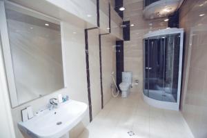 a bathroom with a sink and a toilet at Goy Gol Lake Resort in Goygol +76 photos