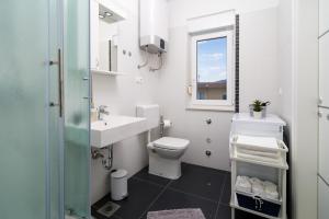 Kúpeľňa v ubytovaní Lotus Apartman + 36 fotografií