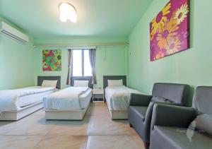 Ein Bett oder Betten in einem Zimmer der Unterkunft Kinmen Line In Bed and Breakfast