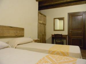 A bed or beds in a room at Agriturismo Battaglia