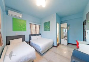Ein Bett oder Betten in einem Zimmer der Unterkunft Kinmen Line In Bed and Breakfast