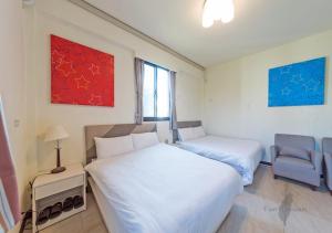 Ein Bett oder Betten in einem Zimmer der Unterkunft Kinmen Line In Bed and Breakfast