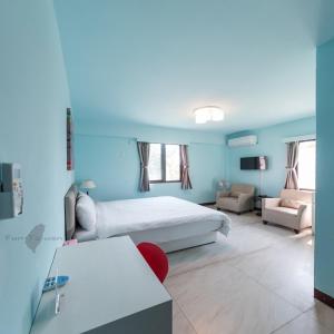 Ein Bett oder Betten in einem Zimmer der Unterkunft Kinmen Line In Bed and Breakfast