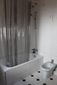 a bathroom with a shower and a toilet and a sink at Casa Nieves in Ronda +19 photos