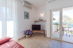 Televisyen dan/atau pusat hiburan di Apartments Ivona