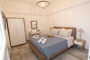 Ένα ή περισσότερα κρεβάτια σε δωμάτιο στο Villa Veranda