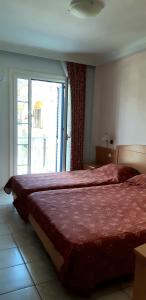 Кровать или кровати в номере Hotel Tolo
