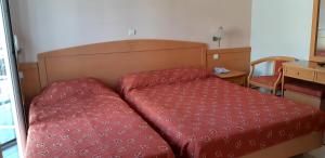 Кровать или кровати в номере Hotel Tolo