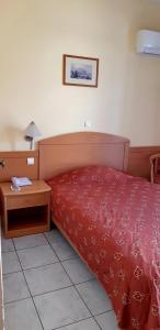 Кровать или кровати в номере Hotel Tolo