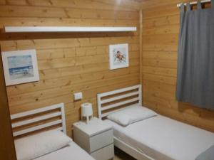 A bed or beds in a room at Camping Dal Pino