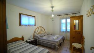 Postel nebo postele na pokoji v ubytování Residenza Su Prelau