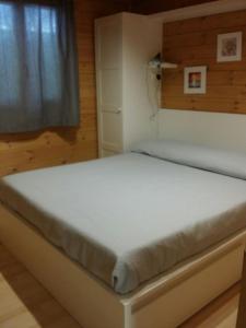A bed or beds in a room at Camping Dal Pino