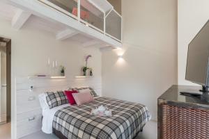 Letto o letti in una camera di L'ALBEROCASA