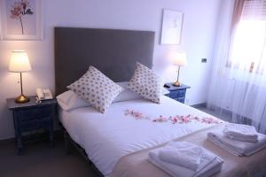 Ένα ή περισσότερα κρεβάτια σε δωμάτιο στο El Sueño del Infante