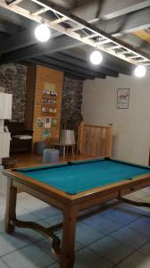 a pool table in the middle of a room at MARGARIDOU in Blesle