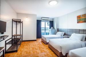 Katil atau katil-katil dalam bilik di Livotel Express Hotel Bang Kruai Nonthaburi