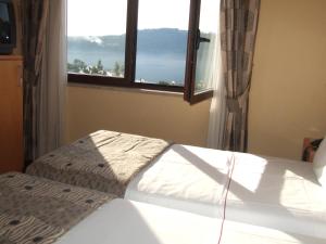 Posteľ alebo postele v izbe v ubytovaní Riviera Hotel