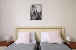 Łóżko lub łóżka w pokoju w obiekcie Luglie 360° panoramic terrace