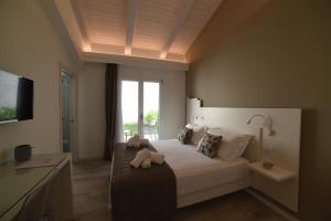 a bedroom with a bed with teddy bears on it at La Torre del Mulino - SUPERIOR Rooms in Tropea