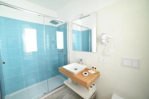a bathroom with a sink and a glass shower at La Torre del Mulino - SUPERIOR Rooms in Tropea +72 photos