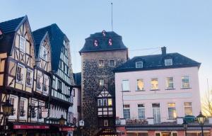 a group of buildings on a city street at Im kleinen Stil ll in Linz am Rhein +8 photos