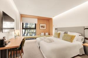 Postel nebo postele na pokoji v ubytování Protur Naisa Palma Hotel