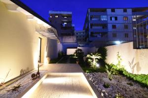 a courtyard of a building at night at La Torre del Mulino - SUPERIOR Rooms in Tropea