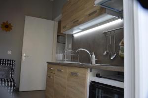 a kitchen with a sink and a stove at Daisy Apartment in Asprovalta +49 photos