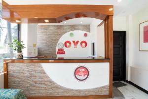 a restaurant counter with a sign that reads ovo at OYO 195 Ranchotel - Biñan in Biñan