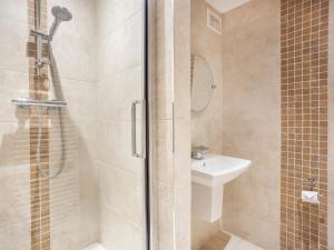 a bathroom with a shower and a sink at Fountains view Apartment in York