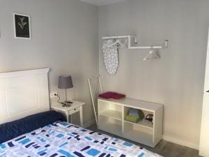 A bed or beds in a room at APARTAMENTOS GyC VIVIENDAS GOLD