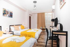 Postel nebo postele na pokoji v ubytování Diuma Hotel