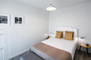 Postel nebo postele na pokoji v ubytování JR Studios & Suites I Rius I