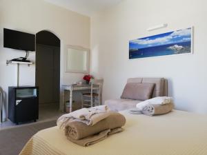 Postel nebo postele na pokoji v ubytování Petali Village Hotel