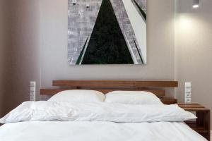 Posteľ alebo postele v izbe v ubytovaní LEOGRAND LOFT Apartments on Lychakivska 4