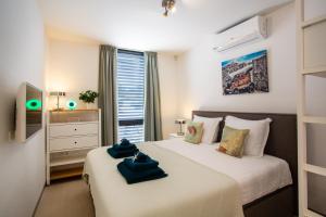 Postel nebo postele na pokoji v ubytování La Vista Luxury Apartment Jan Thiel + 37 fotografií
