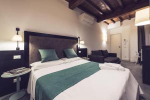 Łóżko lub łóżka w pokoju w obiekcie Dolcevita Apartments