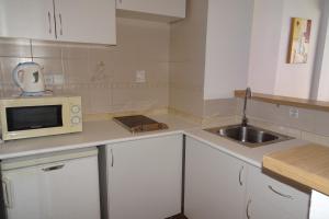 Una cocina o zona de cocina en Evamar Apartments