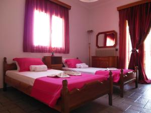 Postel nebo postele na pokoji v ubytování Lygies Apart Hotel