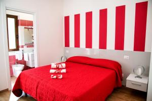 Postel nebo postele na pokoji v ubytování b&b binario nove e tre quarti