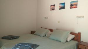 Postel nebo postele na pokoji v ubytování Theo Apartments