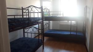 Postel nebo postele na pokoji v ubytování Enjoy The Hostel