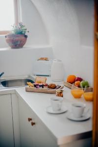 Afbeelding uit fotogalerij van Pueblo Viejo Suites in Kamari +37 foto's