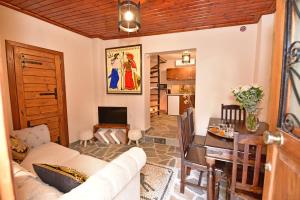 a living room with a couch and a table at Athina house in Rhodes Town