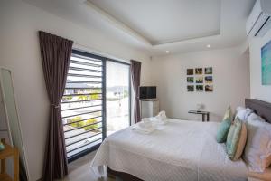 Letto o letti in una camera di La Royal Penthouse Apartment Jan Thiel