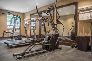 a gym with several tread machines and a treadmill at Comfort Inn Chatham in Chatham