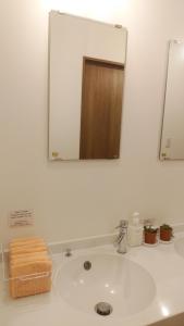 Koupelna v ubytování Okunikko Guesthouse JUN