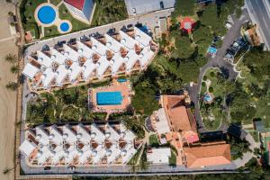 an overhead view of a resort with a swimming pool at Macdonald Leila Playa Resort in La Cala de Mijas