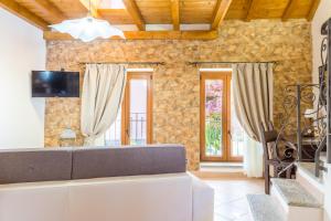 Televízia a/alebo spoločenská miestnosť v ubytovaní Guest House Casa del Folletto