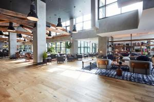 a lobby of a building with couches and tables at Hotel Kabuki, part of JdV by Hyatt in San Francisco